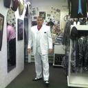 John tries on his White tuxedo...neat shoes, too!