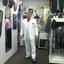 John tries on his White tuxedo...neat shoes, too!