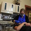 Post Falls dentist Sunnshine Welton with one of her child patient