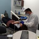 Hugo cosmetic dentist Brent Sorenson DDS working on one of his patients at 