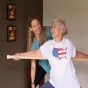 Holistic Yoga Therapist Moriah Diederich works with Evelyn in a private yog