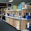 Cases and power supplies on middle shelving unit