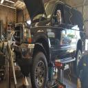 Action Auto Clinic working on a Ford Excursion