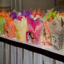 Simple touches set the mood. Polka-dot boxes and bright tissue make for par