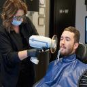 Dental assistant using laser at Brentwood TN dentist Nashville Dentistry Co