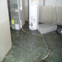 Water that has been stagnant in a basement for several days, causing rot.