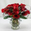 A dozen red roses, the classic gift in floral arrangements.