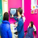 Pediatric dentist Dr. Ciano explaining the dental x-ray results to her pati